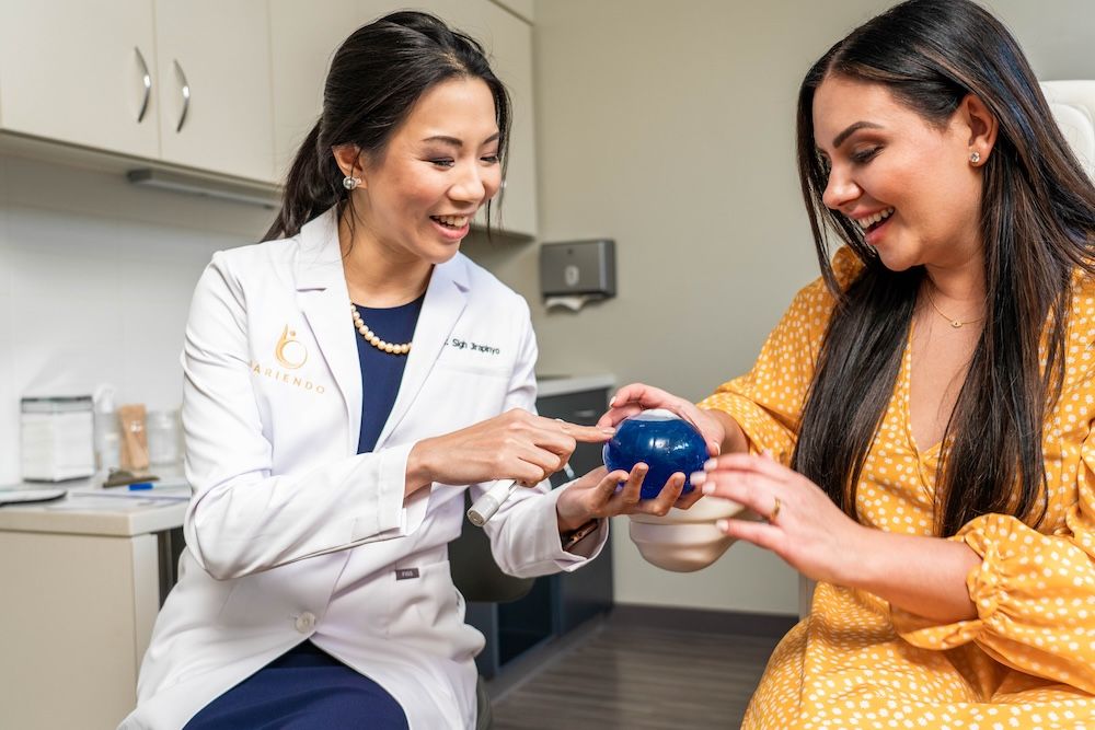 Doctor shows Orbera gastric balloon to a patient